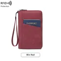 Wine red RFID blocking travel wallet in textured leather with a convenient wrist strap - Burgundy