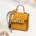 Yellow pebble leather mini handbag bag charm with gold metal clasp and floral silk scarf - Yellow
