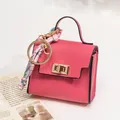Mini bright pink lychee grain leather handbag keychain with decorative floral silk scarf - Rose Red
