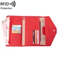 Red RFID passport wallet with multiple card slots and secure snap closure for travel - Red