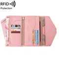 Pink RFID passport travel wallet with multiple card slots and internal zipper pocket - Pink