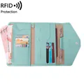 Light blue RFID blocking passport holder in scratch-resistant cross-grain leather finish - Light Green