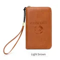Light brown RFID travel passport wallet with embossed globe design and wrist strap - Brown