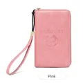 Long pink RFID passport wallet with zipper closure and wrist strap for travel organization - Pink
