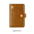 Light brown leather RFID passport holder with gold airplane charm and snap button - Light Brown