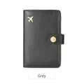 Grey RFID blocking passport holder with gold airplane logo and metal buckle closure - Gray