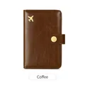 Brown RFID leather passport holder with gold airplane logo and secure snap button - Coffee