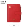 Red RFID travel wallet and passport holder with golden airplane pattern and secure buckle - Red