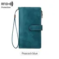 Peacock blue RFID blocking leather long wallet with secure wrist strap and stitching - Teal
