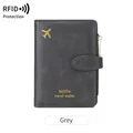 Minimalist grey RFID travel wallet with airplane icon and secure buckle closure - Gray