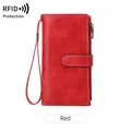 Red RFID blocking long wallet in oil wax leather with wrist strap and buckle closure - Red