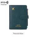 Peacock blue RFID travel wallet with airplane pattern and gold zipper detail - Teal