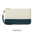 Pochette chic en similicuir bicolore bleu paon et blanc avec une dragonne amovible - Bleu sarcelle