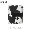 Women's tri-fold wallet with RFID protection in black and white cow print pattern - Cow Pattern Black