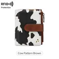 Women's tri-fold wallet with black and white cow print, brown strap and RFID protection - Cow Brown