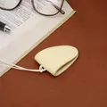 Beige leather magnetic glasses clip with neck strap shown on a professional desk setup - Yellow