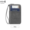 Grey RFID blocking travel wallet with textured leather finish and wrist strap - Gray