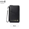 Black RFID blocking passport wallet with gold airplane accents and wrist strap - Black