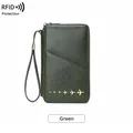 Green RFID blocking passport wallet with airplane charms and pebble leather finish - Green