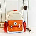 Kids' school backpack in cream, orange and red patchwork with Good Luck embroidery - Orange Large