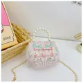 Detail of pink floral embroidery and traditional knot on kids handbag with pearl handle - Pink With Frog Buttons