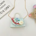 Light blue floral panda handbag for girls with pearl handle and butterfly charms - Green