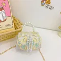 White embroidered girls handbag with pearl handle and floral pattern in white finish - White Single Breasted