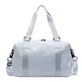 Light blue quilted travel bag with large capacity and adjustable shoulder strap - Blue