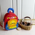 Kids cute cartoon lion backpack in vibrant red and blue with mesh side pocket for school - Red