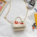 Mini cream woven girls handbag with pearls, cherry charms, and floral decoration - Cherry Style / Khaki