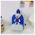 Detail of blue and yellow plaid kids backpack with a 3D plush bear and canvas texture - Bear Series / Blue