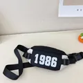Kids black waist bag with white 1986 print and adjustable strap for boys casual wear - White