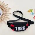 Kids black and red chest bag with 1986 print and adjustable buckle strap - Red