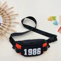 Kids chest bag in black and orange nylon with 1986 print for boys trendy casual wear - Orange