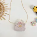 Pink mini crossbody bag for girls with pearl handle, floral decor and chain strap - Perfume Pink