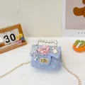 Mini light blue tweed girls crossbody bag with pearl handle and floral accent - Perfume Blue