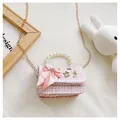Close-up of pink plaid crossbody bag with pearl handle and metal chain for girls - Plaid Bow / Pink
