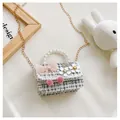Detail of tweed children's bag featuring pearl handle and pink bow with daisy charms - Flower Bow / Black
