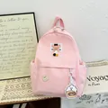 Roze nylon schoolrugzak met sterborduursel en een schattige cupcake-bedel hanger - Roze