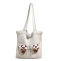 Beige knit tote bag featuring cute plush cat dolls in front pockets with a retro knit style - White