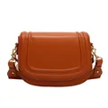 Classic tan leather saddle bag for women with wide shoulder strap and gold hardware - Brown