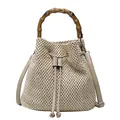 Chic beige straw bucket bag with iconic bamboo handle and drawstring closure for women - Khaki