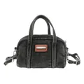 Detail of black washed denim Boston bag featuring textured fabric and metal logo tag - Black