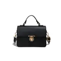 Bolso negro de piel con textura lichi, cierre giratorio dorado y asa superior - Negro