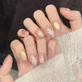 Handmade press-on nails featuring white floral patterns and gold shimmer details - Extra Small (XS) / New Short Square