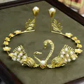 Elegant gold twin swan hair crown with pearls and floral details for cake toppers - Gold
