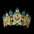 Detailed close-up of Baroque crown with blue teardrop gems and intricate gold metalwork - Gold with Lake Blue Gemstones
