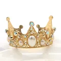 Detailed macro view of a gold hollow-out crown with white pearls and colorful rhinestones - S / Gold