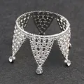 Macro shot of silver mini crown cake topper with sparkling rhinestones on grey surface - Full Rhinestone 6-petal Silver