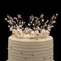 Elegant gold crown cake topper with pearls and lace flowers on a cream birthday cake - Gold Pearl Star Crown